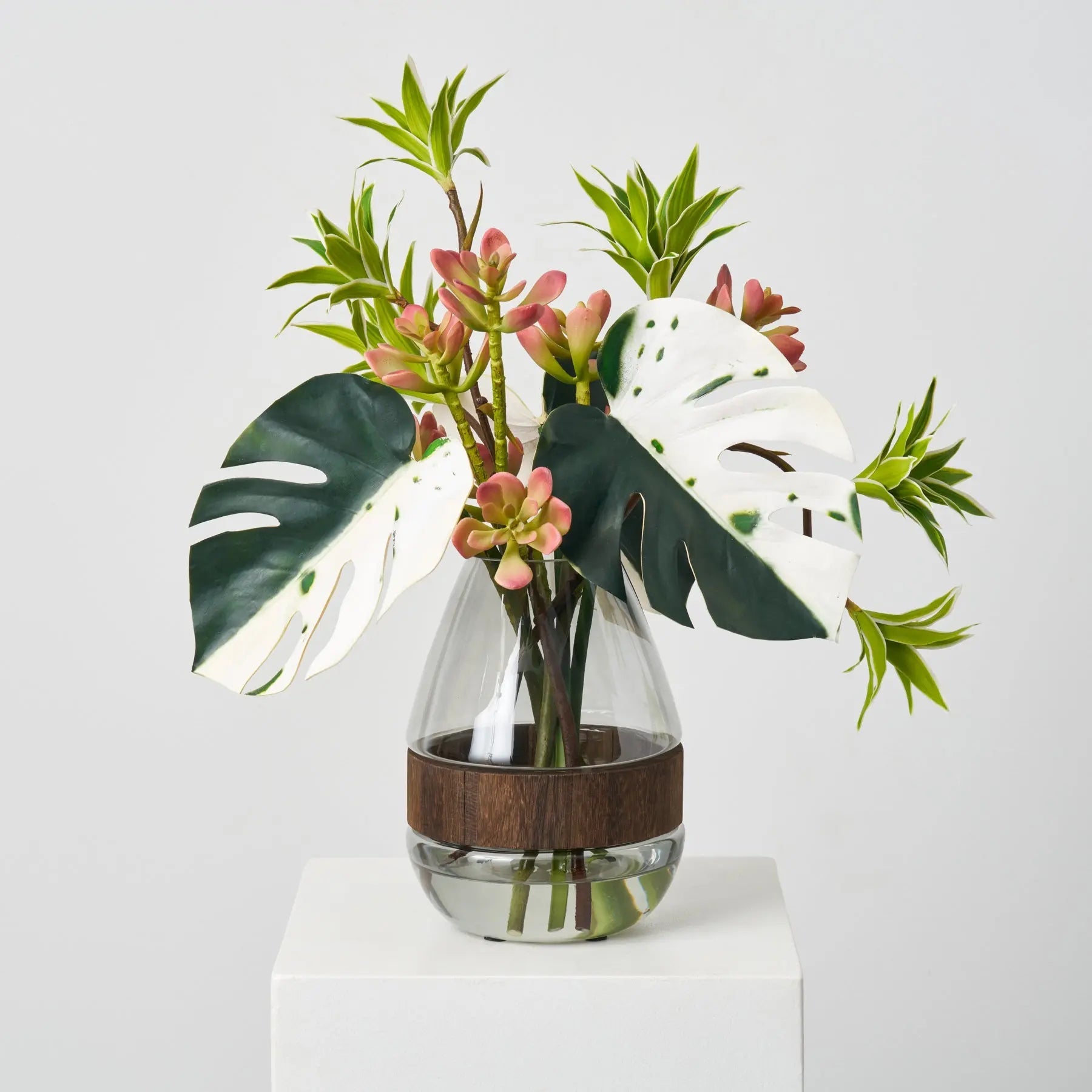 Tropical Muse - Green Albino Monstera Leaf, Dracaena & Succulent in Smoke Wood Vase Everyday Water Illusion Centerpiece Arrangement - Darby Creek Trading