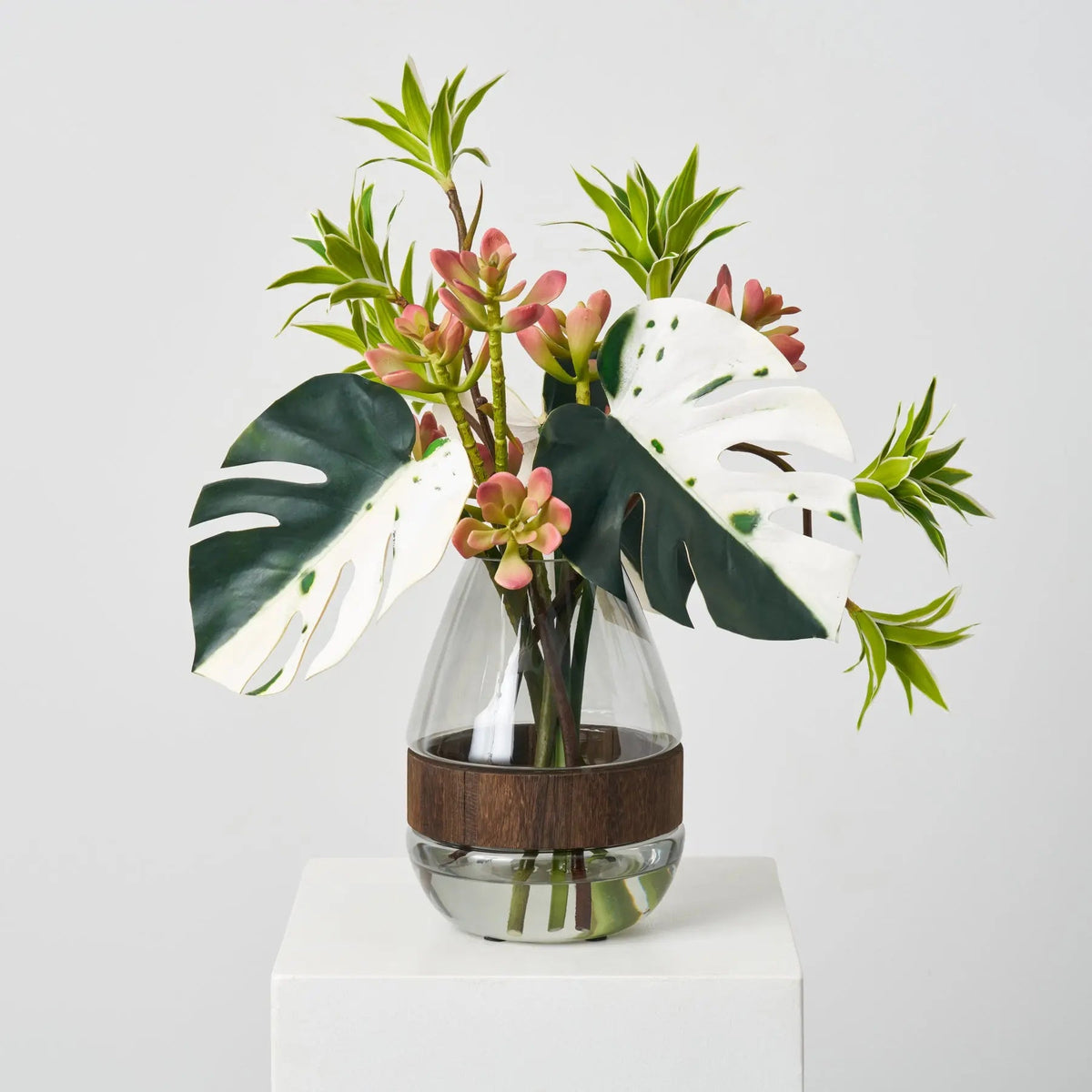 Tropical Muse - Green Albino Monstera Leaf, Dracaena & Succulent in Smoke Wood Vase Everyday Water Illusion Centerpiece Arrangement - Darby Creek Trading
